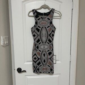Black cocktail dress with sparkly geometric design Size 9